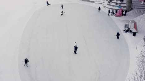 Aerial-shot-of-people-playing-hockey-on-public-ice-at-the-forks-in-Winnipeg-Manitoba