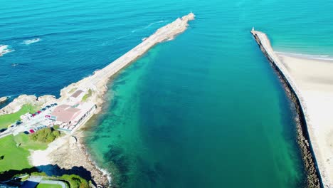 Coastal-protection-and-port-protection-structures,-rockfill-sea-dikes-and-a-beautiful-blue-sea