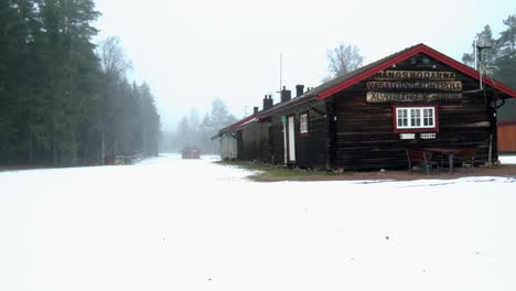 Log-Cabin-At-Vasaloppet,-Snow-Covered-Area,-Sweden