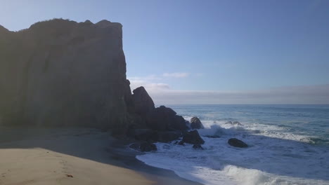 Drone-shot-of-beautiful-cliffed-beach