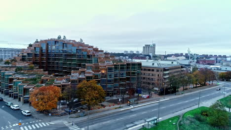 Modern-apartment-building-design-in-Sweden-next-to-a-park-on-an-overcast-day-aerial-view