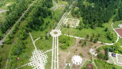 Massive-park-with-pathways-and-roundabout-in-Georgia,-aerial-drone-view