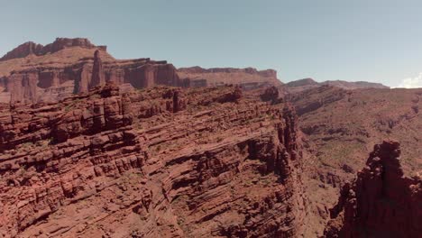 Aerial:-Shattered-and-deep-red-sandstone-canyon-walls-near-Moab-Utah