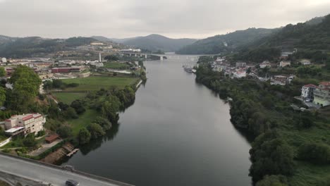 Tãmega-and-Douro-River-against-mountains-and-sky,-Entre-os-Rios,-Portugal