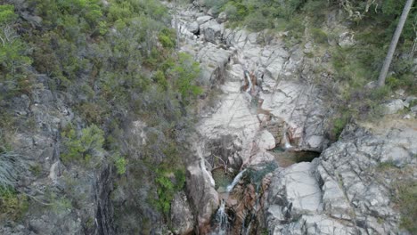 Aerial-flyback-over-pristine-water-of-waterfall-of-Portela-Do-Homem-in-Portugal