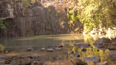 Creek-With-Steep-Rugged-Cliffs-On-Sunny-Day---Cedar-Creek-Falls-In-QLD-Australia