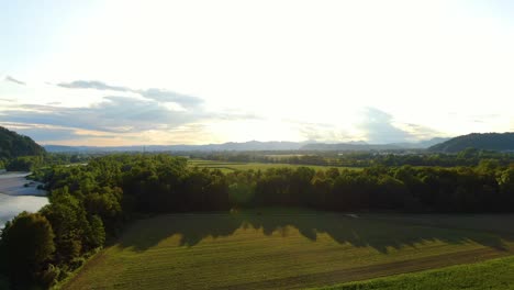 Farmland-close-to-Ljubljanica-and-Sava-river-confluence-in-Podgrad-village,-Slovenia,-Aerial-pan-left-reveal-shot-view