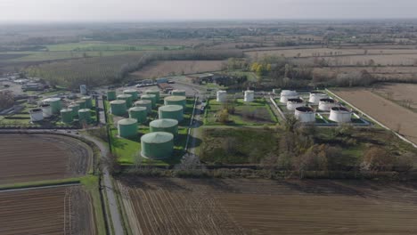 Aerial-view-of-steel-round-Oil-Storage-Tanks,-storage-and-handling-services-for-petroleum-products
