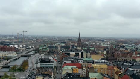 Aerial-hyperlapse-of-Malmo-or-Malmö-city-in-Sweden,-drone-swedish-cityscape-in-Europe-metropolitan-area-timelapse