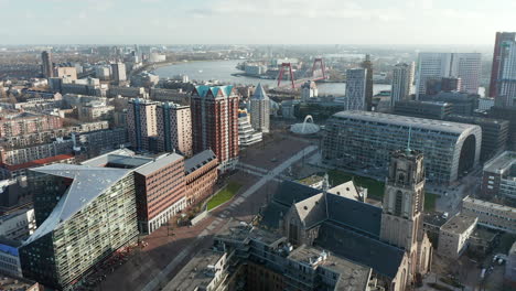 Aerial-View-of-Laurenskerk-and-Markthal-skyline-in-Rotterdam-downtown---drone-shot