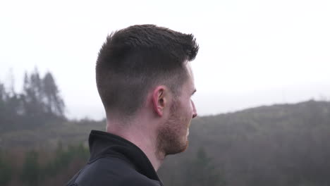 Side-Profile-of-Active-Hiking-Man-Overlooking-Dramatic-Landscape