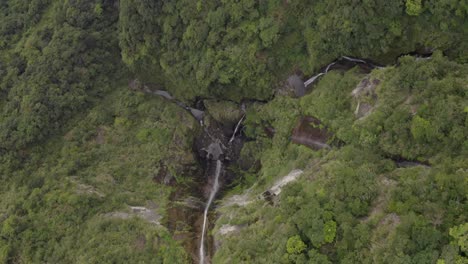 Aerial-view-above-birds-eye-Taiwan-woodland-high-wilderness-jungle-waterfall-cascading-below