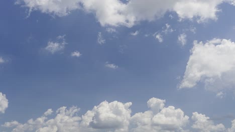 Clouds-rolling-in-the-bright-blue-sky--time-lapse