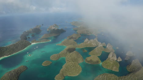 Drone-of-Raja-Ampat,-Indonesia---Flying-through-cloud