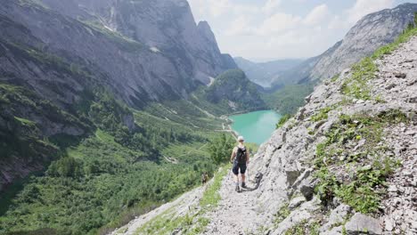Female-hiker-walking-down-a-mountain-path-in-the-Austrian-alps