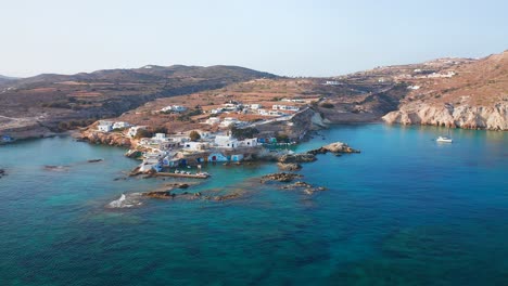 Mandrakia-greek-Milos-island-scenic-dolly-drone-shot,-aerial-landscape-of-seaside-town