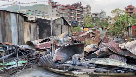 Twisted-tin-sheets-and-the-ruined-remains-of-a-restaurant-after-a-fire