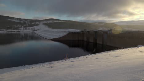 Water-Power-During-Snowfall,-Renewable-Energy-In-Sweden,-Static-Shot