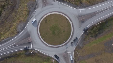 Rural-roundabout-near-small-Iceland-town,-Hringvegur-road,-top-down-aerial