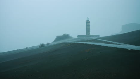 Stunning-cinematic-wide-shot-of-the-Ponta-dos-Capelinhos-lighthouse-in-a-storm