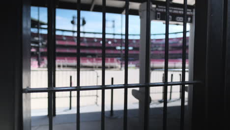View-through-fence-into-empty-baseball-stadium