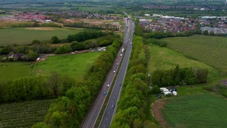 Drone-ascending-over-the-A2-dual-carriageway-looking-towards-Canterbury-new-housing-development