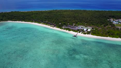 Soft-wide-panoramic-bird's-eye-view-over-secluded-Maldives-island-and-resort