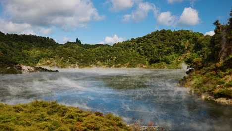 Mystic-steam-hovering-over-surface-of-Frying-Pan-Lake-the-largest-hot-spring-in-the-world,-Waimangu-Volcanic-Rift-Valley,-North-Island,-New-Zealand