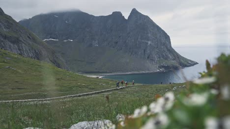 Ryten-hike-pathway-in-Lofoten-area-with-group-of-people-walk-in-Norway