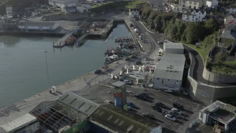 Aerial-flyover-of-fishery-harbour,-Irish-coastal-town-of-Dunmore-East