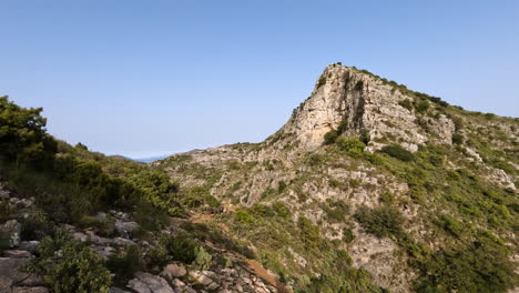 4k-Shot-of-a-large-mountain-top-peak-by-a-hiking-trail-path-at-La-Concha,-Marbella,-Spain