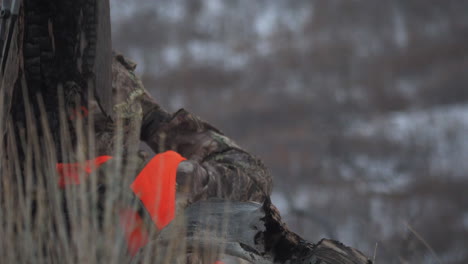 The-masked-hunter-is-aiming-at-the-deer-in-the-animal-hunting-season