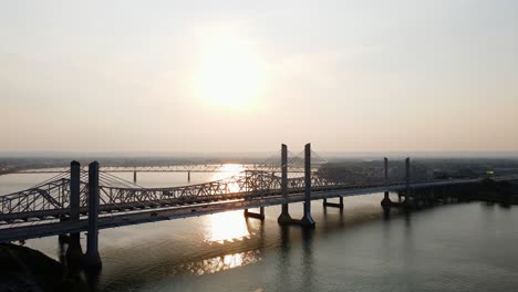 Aerial-drone-view-towards-sunset-above-the-Abraham-Lincoln-Bridge,-in-Jeffersonville,-USA
