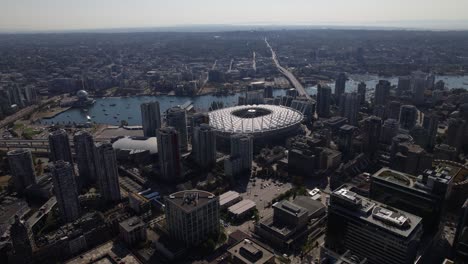 Approaching-the-BC-Place-Stadium-in-sunny-Vancouver,-Canada---Aerial-establishing-view