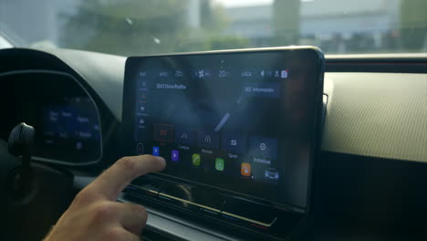 Driver's-Index-Finger-Selecting-Drive-Profile-To-Use-On-Car-Screen
