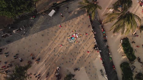 Voladores-traditional-dance-ceremony-show-in-Mexico,-overhead-aerial-view