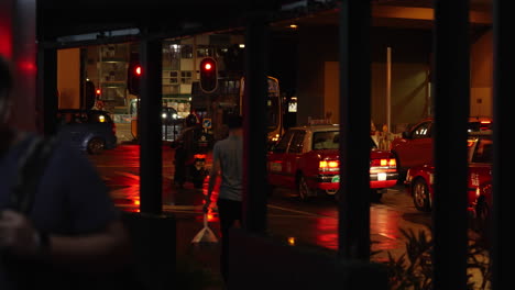 Hongkong--August-04,-2022:-peoples-at-night-walking-across-the-sidewalk