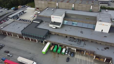 Ventistal-ventilation-company-main-office-and-logo-in-Nesttun-outside-Bergen-Norway---Aerial-moving-towards-roof-and-logo-of-office-headquarter