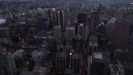 Aerial-view-over-the-cityscape-of-Vancouver-city,-dusk-in-British-Columbia,-Canada