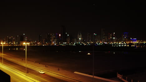 Getting-in-focus-night-cityscape-skyscrapers-seen-from-Juffair-District,-Bahrain
