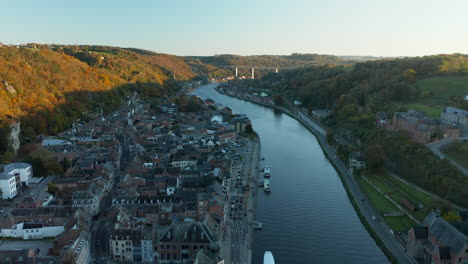 Aerial-View-Of-Dinant-Town-By-The-Meuse-Riverbanks-On-Sunset-In-Wallonia,-Belgium