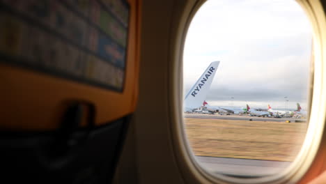 Aircraft-Wing-Window-View-While-Airplane-Taking-Off-From-Lisbon-Airport---POV