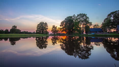 Beautiful-time-lapse-of-a-house-at-a-lake-side-with-symmetrical-reflection-on-water