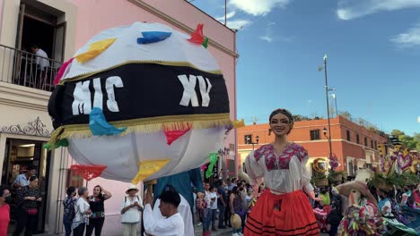 slow-motion-shot-of-a-wedding-celebration-with-traditional-mannequins-and-balloons-in-the-city-of-Oaxaca-in-mexico