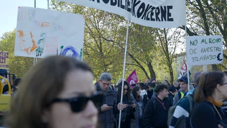 Slomo-shot-of-people-marching-with-banners-against-price-excessive-energy-costs