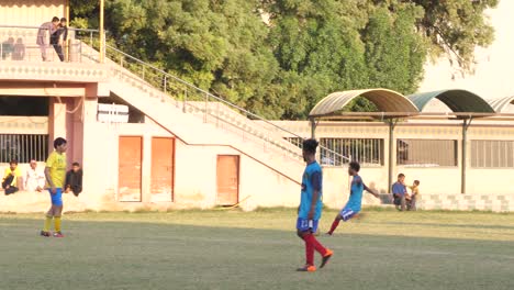 School-kids-playing-soccer-in-the-afternoon-hours-at-outfield