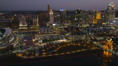 Aerial-view-of-the-Cincinnati-skyline,-fall-evening-in-Ohio,-USA---circling,-drone-shot