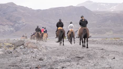 Tourist-riding-horses-in-Thórsmörk-valley-in-Iceland,-recreational-activity