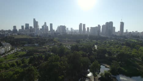 Tel-Aviv-office-buildings-in-the-background---Aerial-sliding-over-yarkon-park-#018