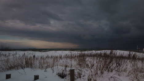 Exterior-panoramic-winter-establishing-shot-of-a-dark-and-stormy-Georgian-Bay-shoreline